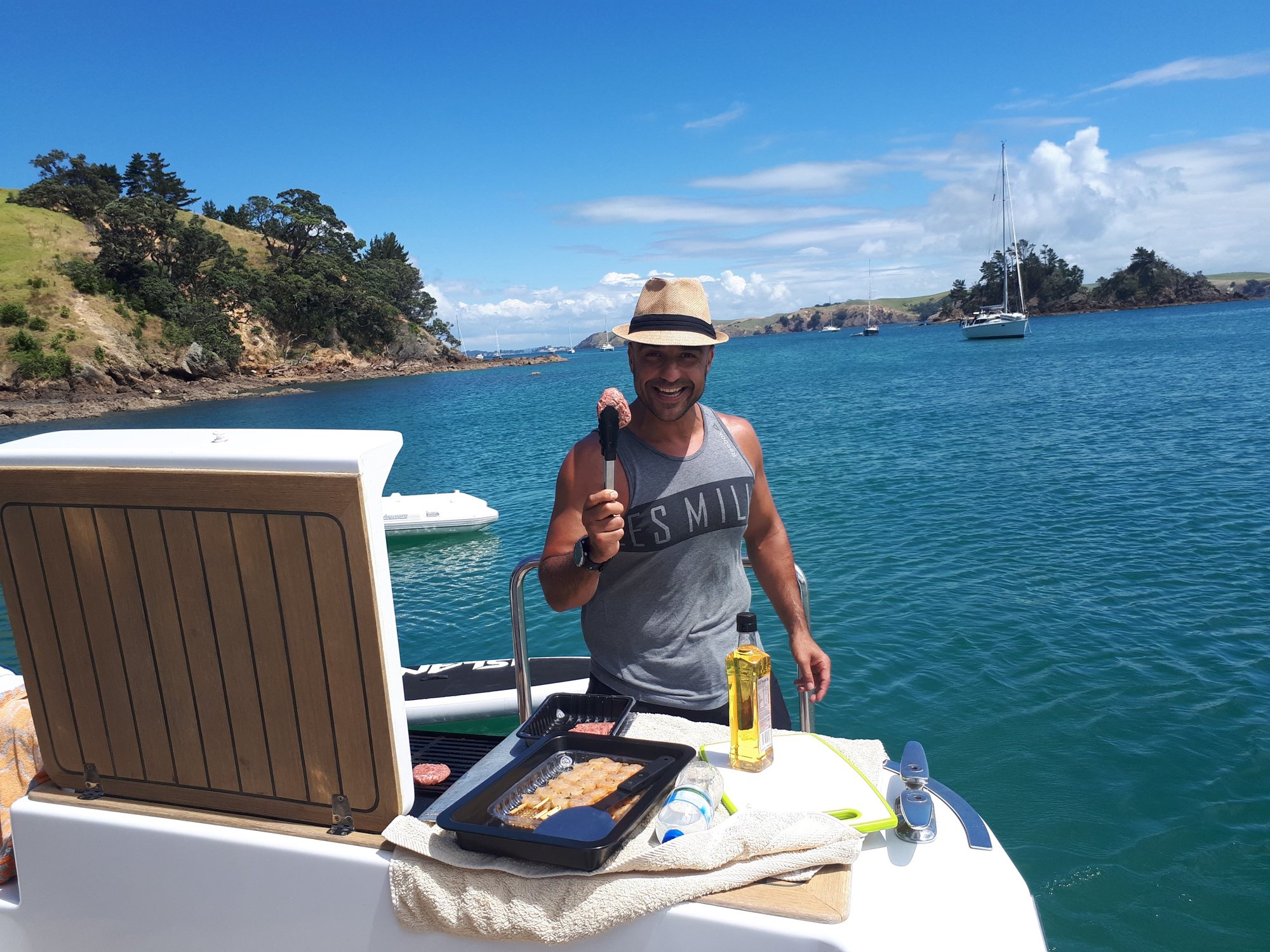A man giving a thumbs up beside the BBQ on Kozmic 5