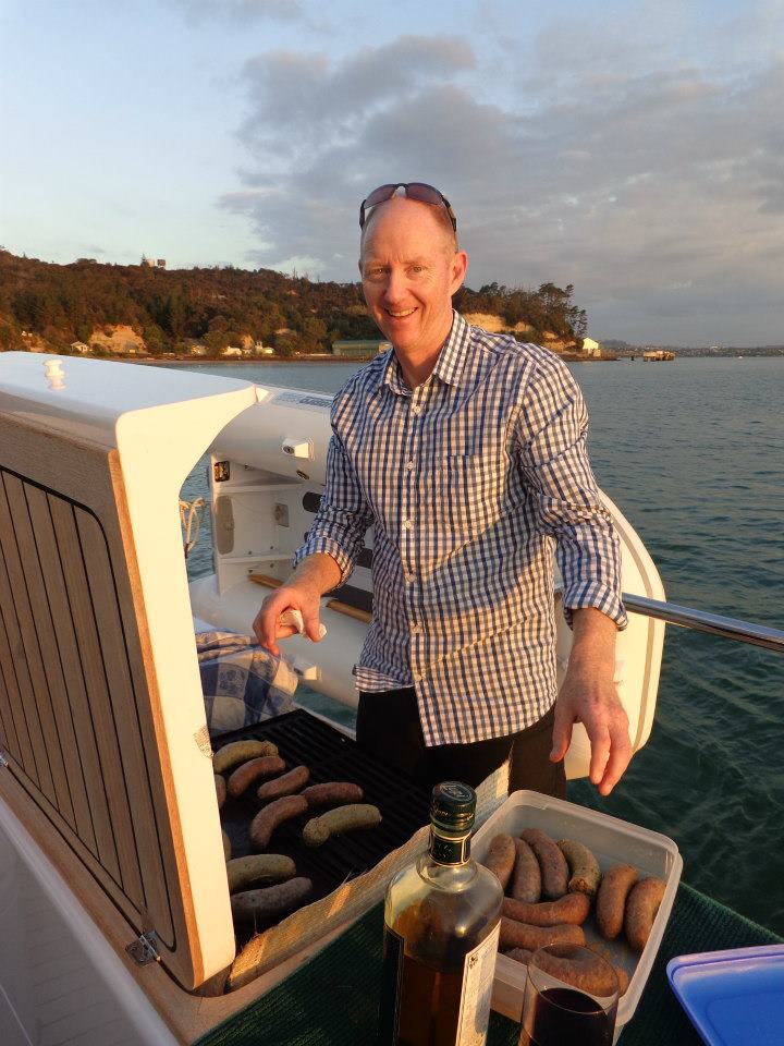 Dave, owner and skipper of Kozmic 5, at the boat's BBQ at sunset